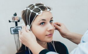 Woman receiving brain mapping therapy in Atlanta GA