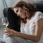 A woman wondering: Can alcohol make your depression symptoms worse?