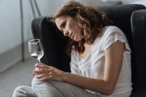 A woman wondering: Can alcohol make your depression symptoms worse?