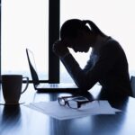 A woman wondering the difference between stress and anxiety.